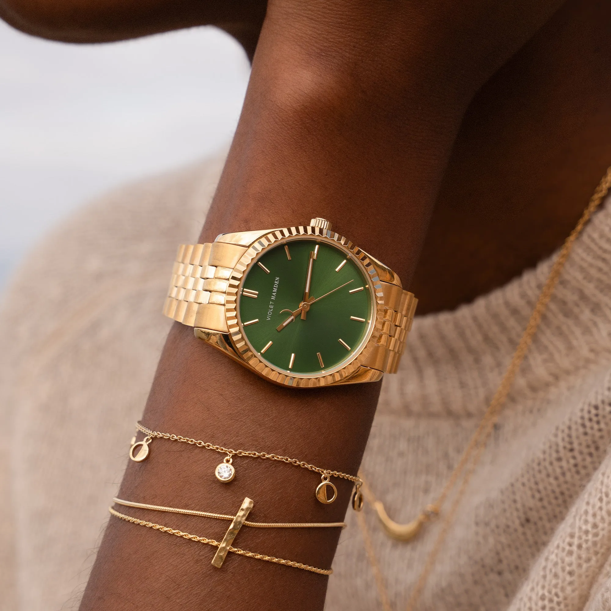 Sunrise round ladies watch gold coloured and green